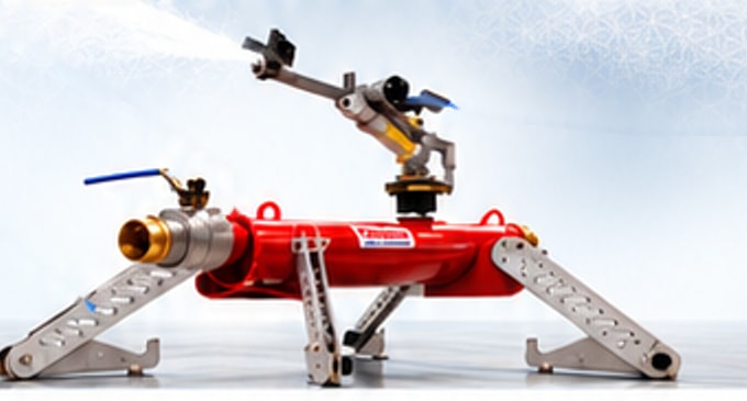 The FireBozz Magnum sprinkler: red central body, rotating spray assembly on top and folding support legs.